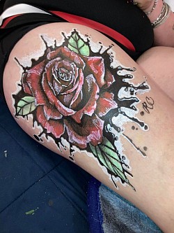 Rose on thigh